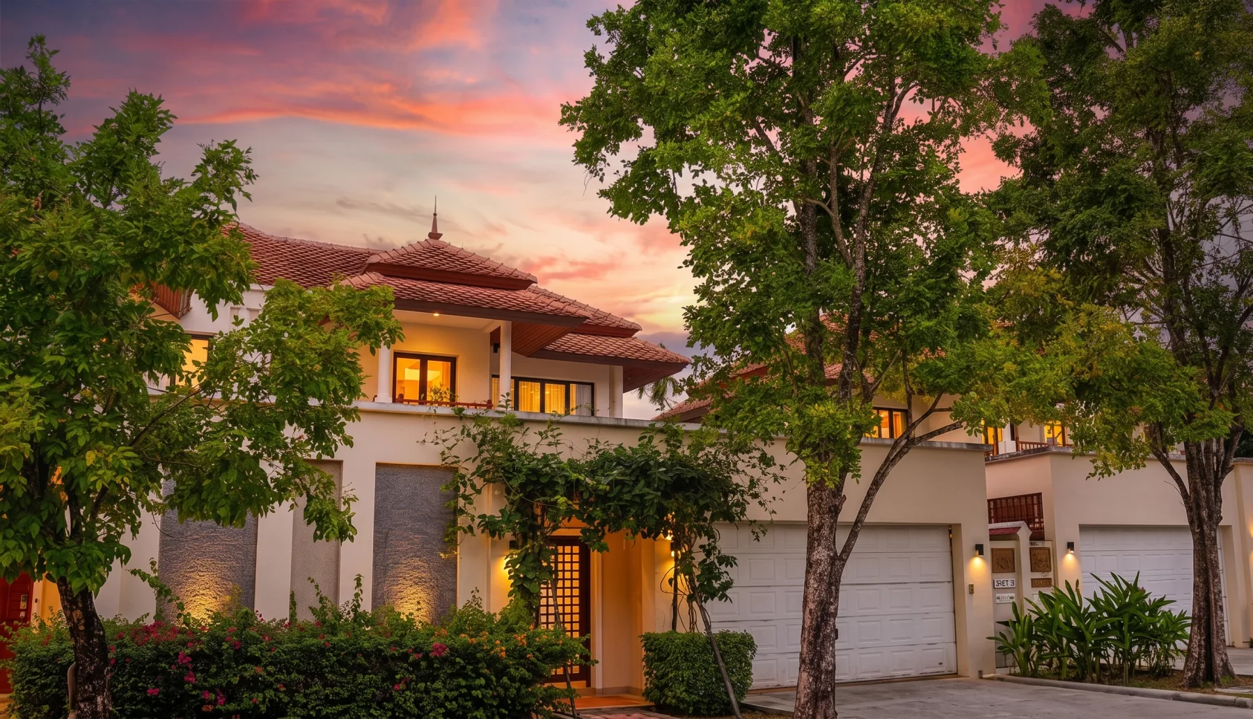 Two-storey 5-bedroom townhome at dusk, Laguna Village, Choeng Thale, Phuket